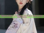 Embracing Winter in a Cheongsam with Laced-up Pants and Embroidery Blossom