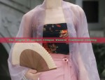 The Short-Sleeve Medium Length Cheongsam:A Blend of Tradition and Modernity
